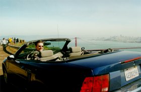 Lindsay in the mustang overlooking Golden Gate Bridge